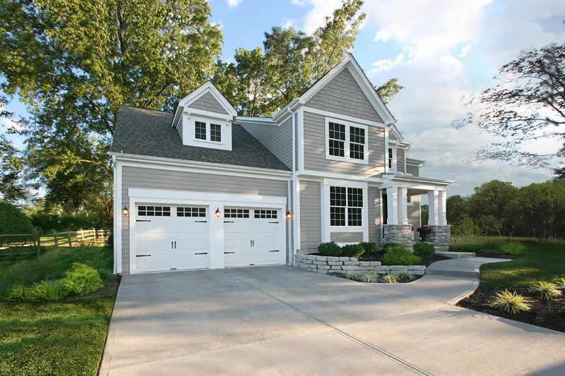 Clopay Gallery Collection steel carriage-house garage door on a suburban home