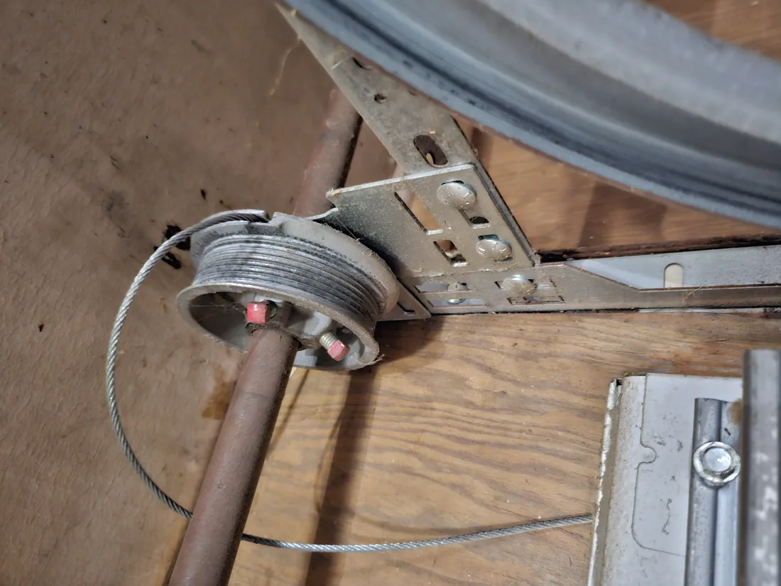 Frayed garage door lift cable replaced on a residential door in the Kansas City metro
