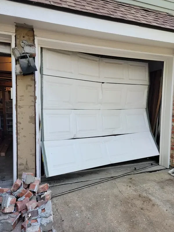A door jumped off its track — don't run the opener, call us.