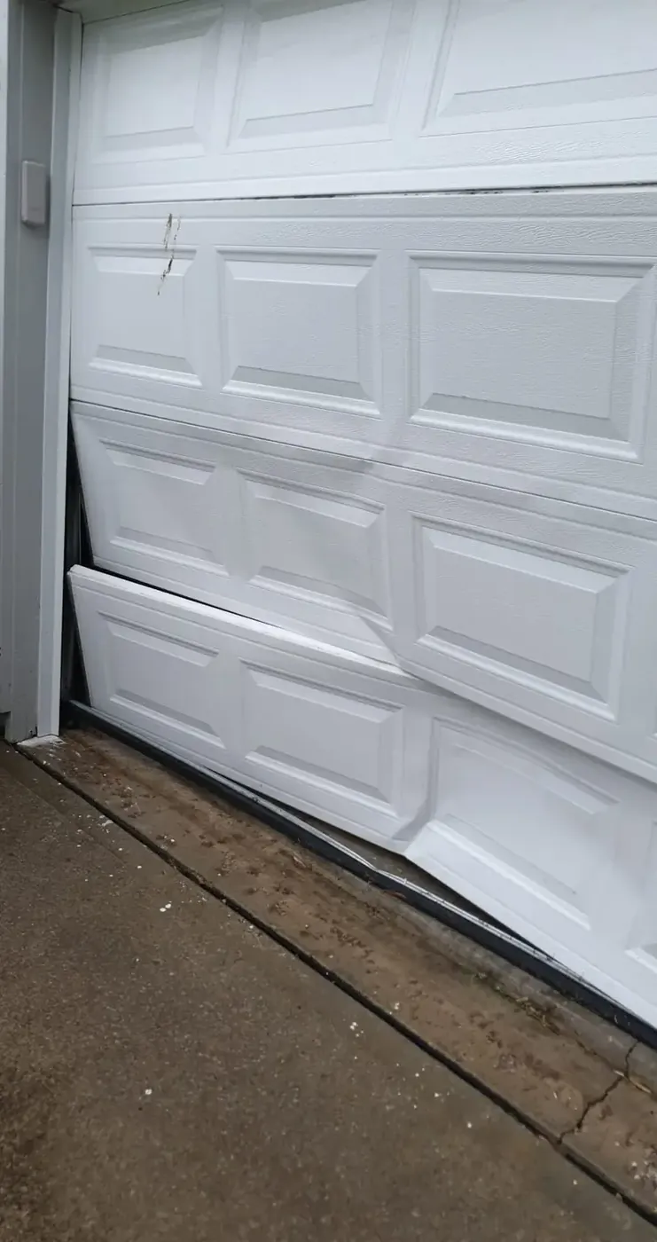 Off-track doors usually trace back to a cable or roller failure.