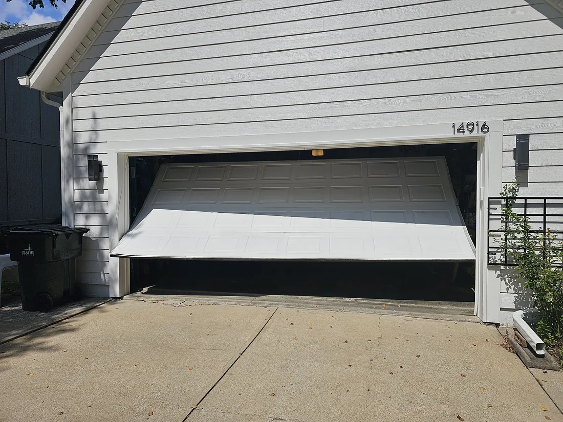 New insulated steel garage door installed on a Leawood KS residential home by GDM KC