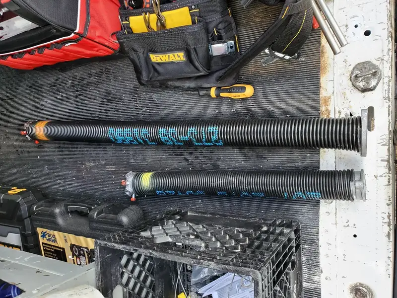 A broken torsion spring — the #1 reason a door won't budge.