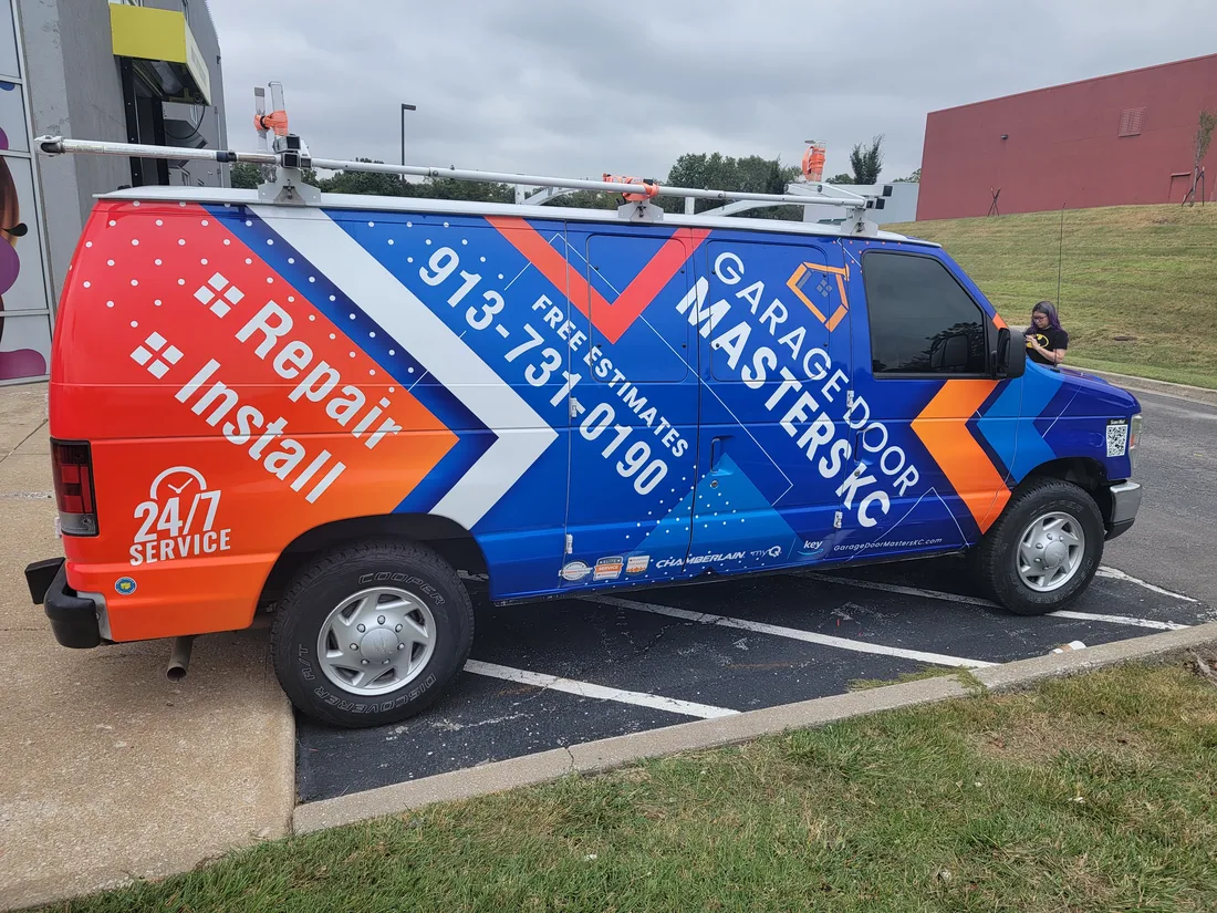 Garage Door Masters KC service truck at a Johnson County garage door repair call